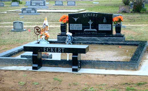 Alternate marble memorial setting with double-width stone, vases and matching bench