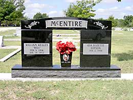 Black marble double-width headstone Black marble vase under double stone