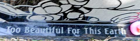 Specialized lettering applied to the foot of an existing customized Teddy Bear stone Sandblasted phrase at the foot of an existing stone